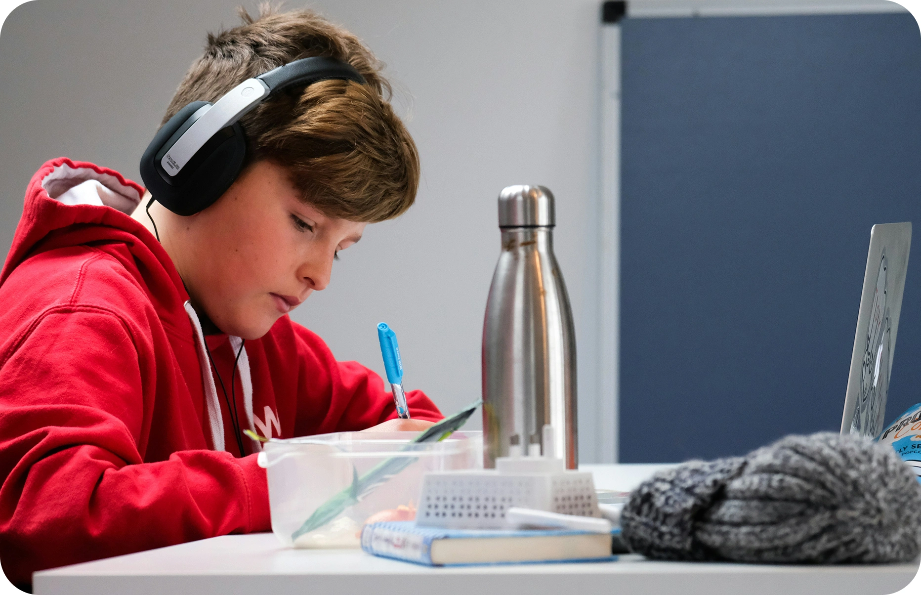 Student studying with headphones on